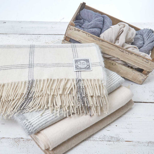 beige wool blankets and pashmina shawls